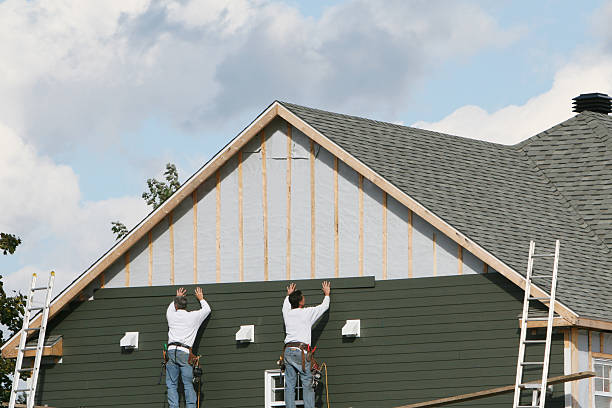 Professional Siding technician working in Etowah, NC